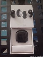 Samsung Buds Live wireless earbuds set with charging case inside original packaging box.