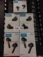 Photo showing six boxes of Soundcore by Anker earbuds including Life P2 Mini Mini Buds, two Life A1 pairs, and two Life P2 pairs all new in sealed retail packaging.
