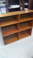 Full front-facing view of Danish teak shelving unit showing four open compartments.