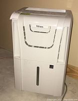 White Danby Premiere dehumidifier front view showing ventilation and water level window