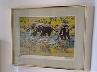 Framed print showing three elephants in water by Paul Blaine Henrie.