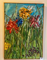 Full view of framed signed oil painting showing colorful floral abstraction.