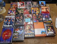 Photo showing about 20 DVDs including anime and tokusatsu series disks