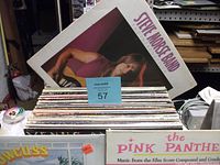 Stack of over 50 vinyl records with Steve Morse Band album cover on top