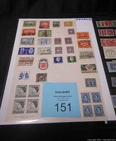 Close up of first page of Canadian stamps showing various used stamps in multiple colors and designs