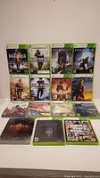 All 14 Xbox 360 games displayed together in their cases, visible cover art for each title