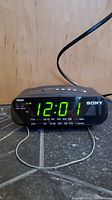 Front view showing digital time display and Sony branding on the radio alarm clock.