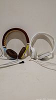 Both pairs of Sony on-ear headphones side by side against a white background, showing overall design and wires.