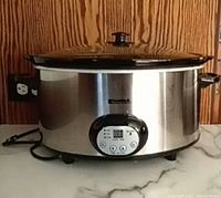 Front view of Kenmore programmable slow cooker placed on countertop, showing overall design and size.