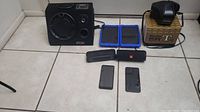 Full lot overview with SDX Bluetooth speaker, two ONN tablets, Minolta SRT101 camera with box, JBL and Blackweb Bluetooth speakers, LG Stylo 4 and 5 smartphones.