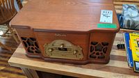 Front view of Electrohome wooden console with speaker grills and control panel
