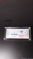 Front view of the Blue Jays Skydome first game ticket dated June 5, 1989, showing logos, event and seat details in plexiglass case.