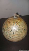 Top view of the pear-shaped glass kerosene lamp showing wick and metal holder