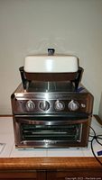 Photo of the stacked Cuisinart air fryer toaster oven with Presto electric skillet on top