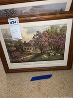 Four framed prints including 'American Homestead Spring','American Homestead Winter','American Homestead Summer' and one floral artwork, framed in wood, each about 11.5 x 15 inches.