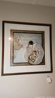 Full view of framed wall art showing dancers in white dresses, capturing overall composition and framing.