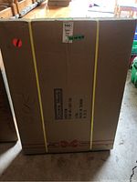 Photo showing sealed packaging box for Crown Mark baker's rack with measurements noted.