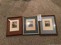 Photo of three framed watercolor paintings all signed by artist, shows general lot contents