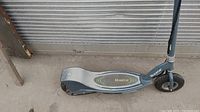 Side view of Razor electric scooter showing deck, frame, and front wheel