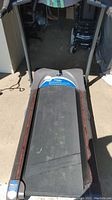Full view of treadmill running belt and front base