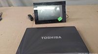 Closed Toshiba laptop with visible logo
