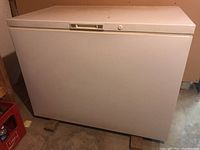 Front and top view of the white Kenmore 150 chest freezer showing overall condition.