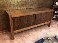 Front view of mid-century buffet showing two sliding rosewood doors