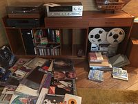 Overall front view showing cabinet with equipment and vinyl records