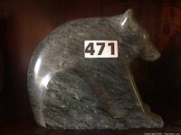 Side view of the soapstone bear figurine showing body and texture