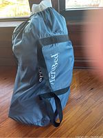Photo of the blue AeroBed branded storage bag containing the mattress and accessories.