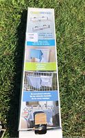 Photo of boxed Smart Clothes Dryer and Hanger on grass, showing front and side panel with product images and usage scenarios.
