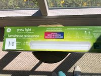 Box of GE LED grow light showing product length and hours of use