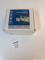 Photo of white retail box for Magellan RoadMate 5230T-LM GPS showing front label with product image and features