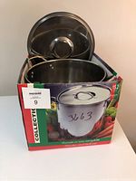 Stock pot and lid in the original box showing front view