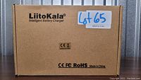 Closed brown cardboard box with LiitoKala branding and compliance logos on top.