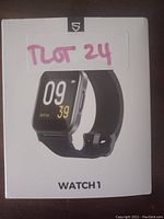 Front box packaging showing image of the Soundpeats Watch 1 smartwatch with digital time display and black band.