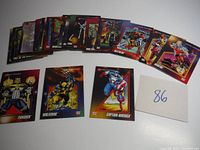 Thirty Marvel Super Heroes trading cards fanned out showing variety of characters and artwork.