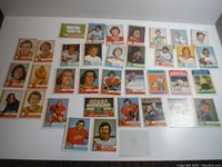Hockey trading cards laid out including multiple teams like Washington Capitals, St. Louis Blues, Philadelphia Flyers, and Detroit Red Wings.