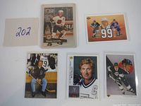 Front side of the 5 Wayne Gretzky hockey cards showing different portraits and action shots.