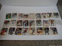 Lot of 25 hockey cards arranged in two rows on white background, showing various players and teams from the 1978-79 season.