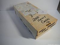 Closed box labelled '2000+/- Hockey Cards' with hockey card brand labels and stickers on surface