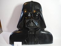Closed Darth Vader molded plastic carrying case showing front and side profile.
