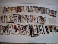 Overall spread of approximately 400 hockey cards arranged in rows on a flat surface