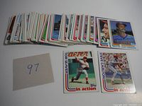 Stack of 54 vintage baseball cards laid out showing various players, including Larry Andersen, Tom Seaver, and Steve Carlton.