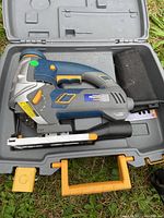 Mastercraft orbital jigsaw inside open hard carrying case, showing tool details and foam padding.