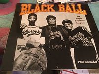 Cover photo of the 1996 Black Ball Negro Baseball Leagues calendar showing three players in vintage 'Clowns' uniforms.