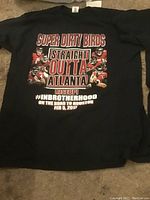 Black T-shirt with text 'SUPER DIRTY BIRDS STRAIGHT OUTTA ATLANTA' and images of players, dated Feb 5, 2017