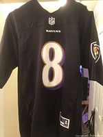 Front view of the black NFL Baltimore Ravens jersey showcasing the number 8 with NFL and Ravens branding.