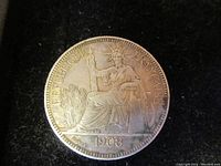 Front side of the 1908 French Indo-China Piastre coin showing seated Liberty figure with 'REPUBLIQUE FRANÇAISE' and date '1908'.