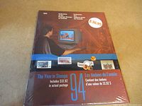 Front cover of the 1994 Collection of the Postage Stamps of Canada booklet with price sticker showing $36.95 and highlighting $32.92 in actual postage.